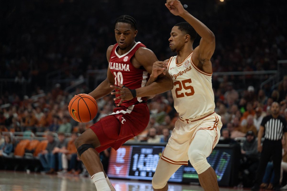 Texas forward Jayson Kent guards Alabama’s Mouhamed Dioubate during the Longhorn’s game against the Crimson Tide on Feb. 11, 2025. 