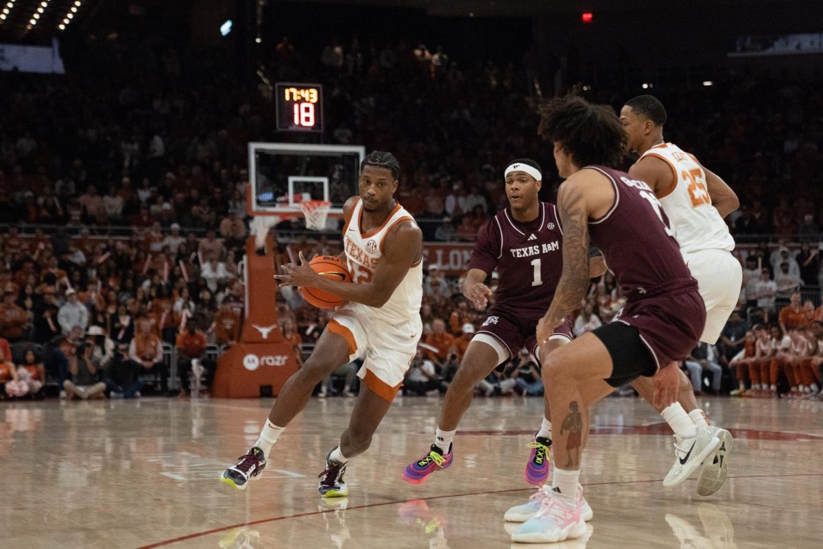 Senior guard Tramon Mark rounds the corner off a screen during the first half against the Texas A&M Aggies on Jan. 25, 2025. Mark ended the game with 11 points, including the game winning layup to make the score 70–69.