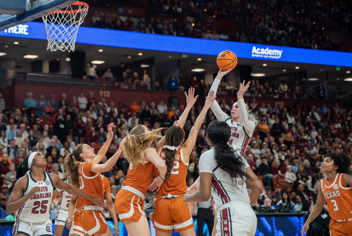 Junior Chloe Kitts shoots a jump shot over three Longhorn defenders during the SEC Championship on March 9, 2025. 