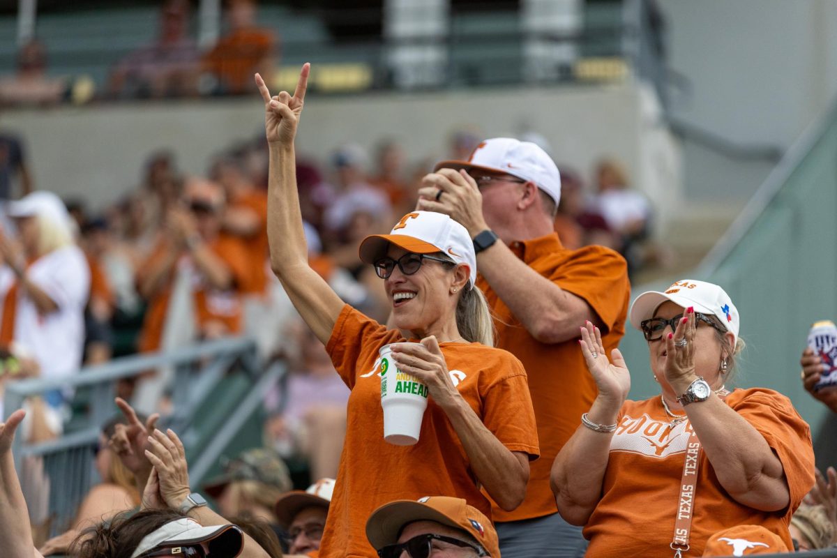 A fan holds up the horns at Disch-Falk Field on April 27, 2025.
