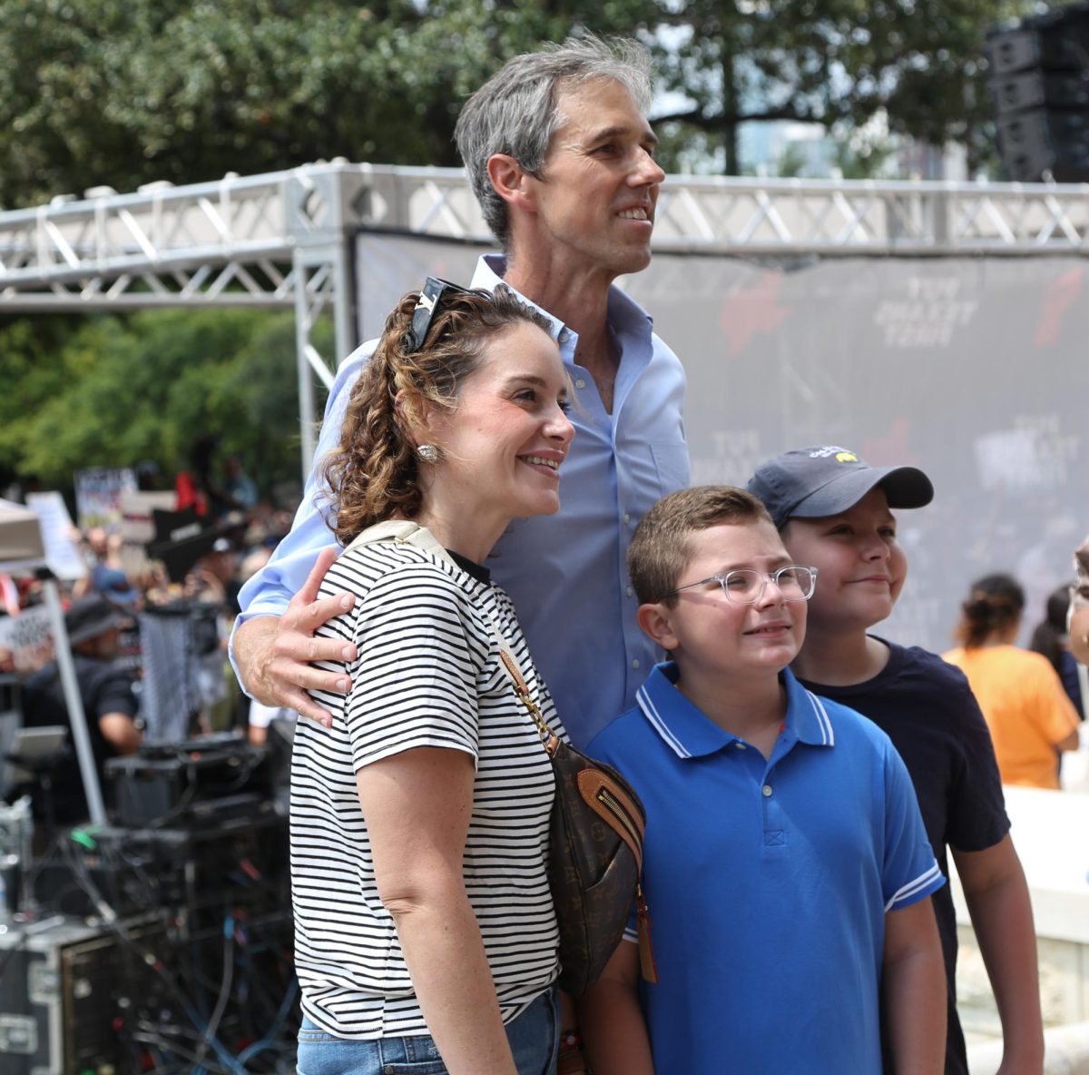 Beto O'Rourke takes pictures with attendees at the Fight The Trump Takeover protest in Austin, Texas on Aug. 16, 2025.