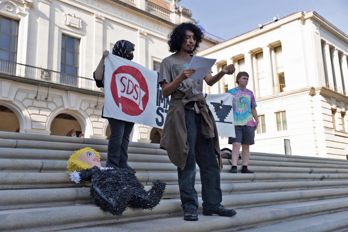 Students for a Democratic Society organized a "Fight Trump's Agenda" protest on the Main Mall Sept. 4. The protest featured speakers from University Democrats, Dr. Angela Valenzeula and Partners in Health. 