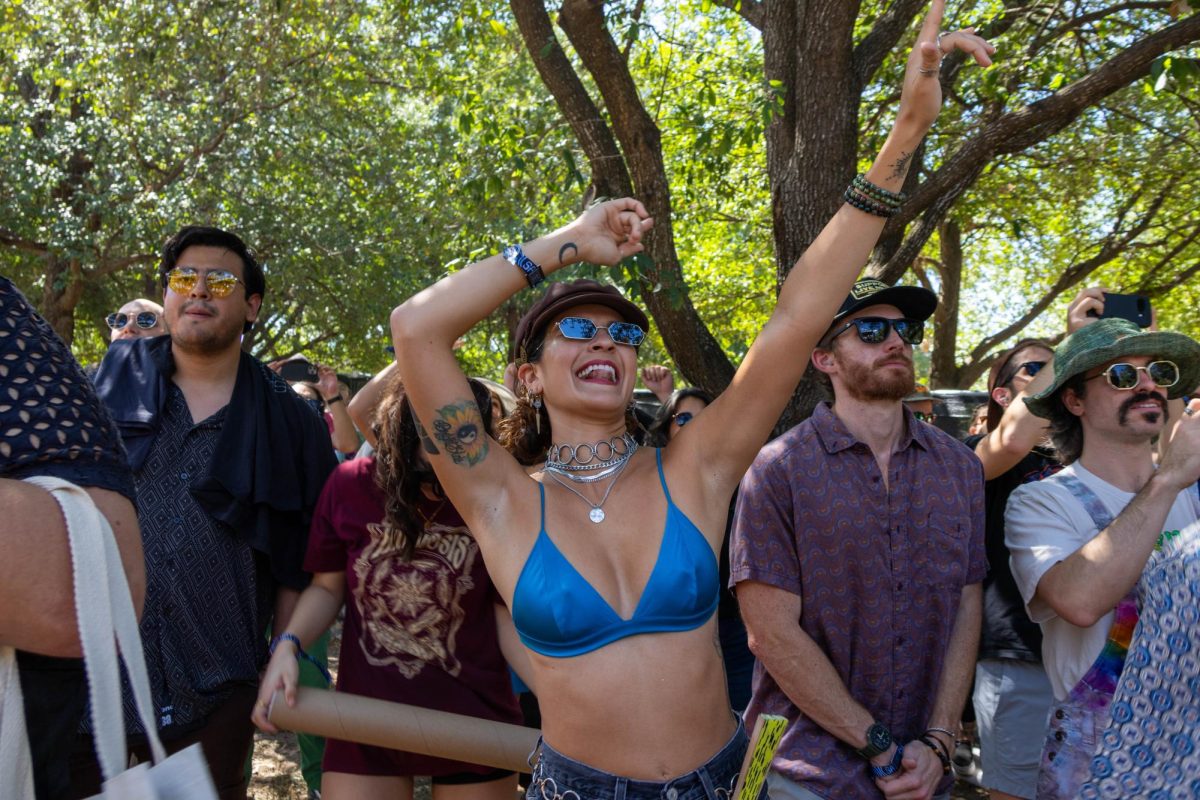A woman dances with her hands in the air during Yīn Yīn’s performance at Levitation music festival on Sept. 27, 2025.