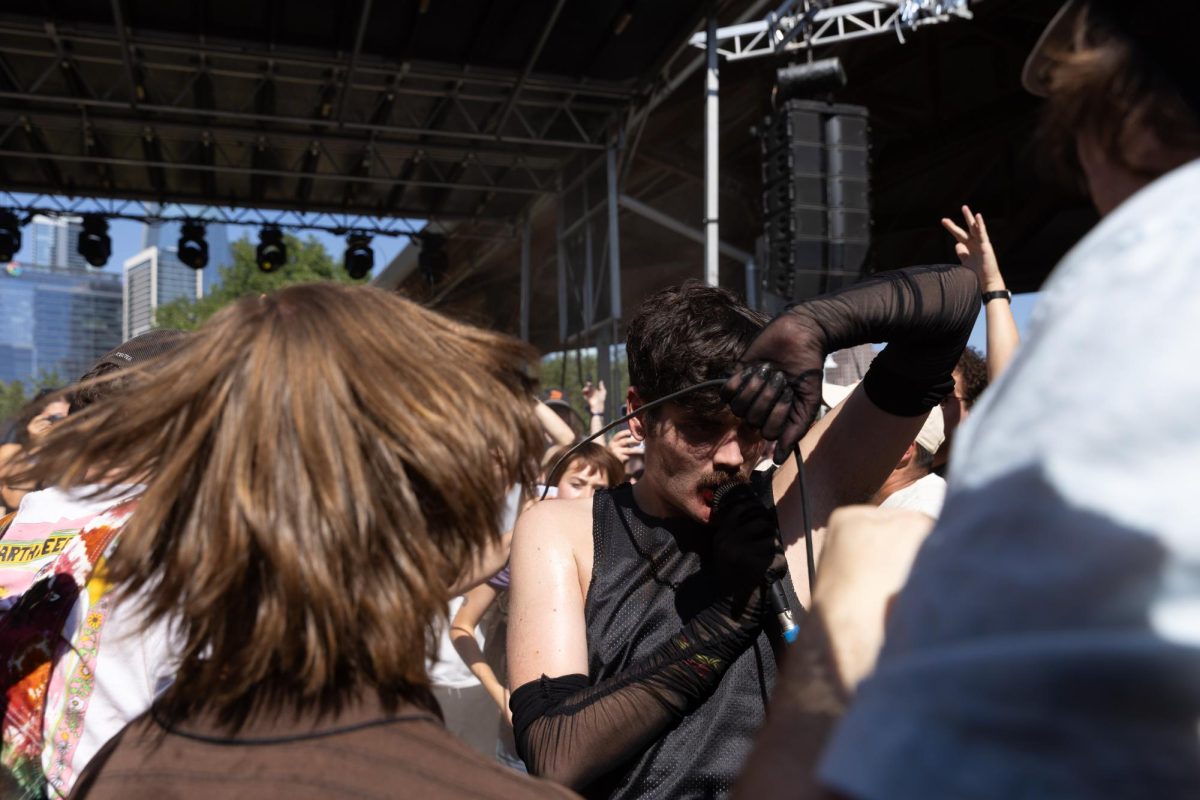 Rock band Model Acritz performs at the outside stage at Levitation at Palmer Events Center on Sept. 27, 2025. The campy performance included an outfit change, smeared lipstick and an impossibly long microphone cord. 