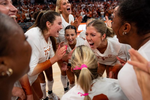 Sophomore Ella Swindle (left) cheers with her team after defeating Stanford 3-2 in the Moody Center on Sept. 7, 2025. 