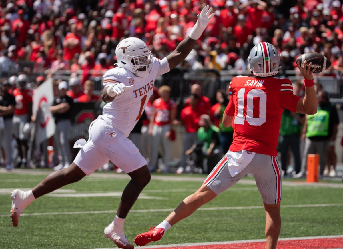 Sophomore Colin Simmons chases Buckeye quarterback Julian Sayin forcing an incompletion during the Longhorns' week one game in Columbus Ohio on Aug. 30, 2025. 