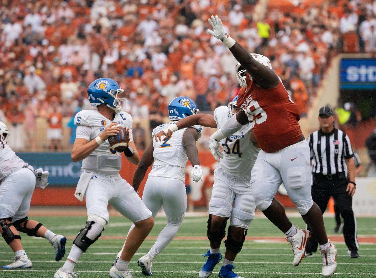Senior Cole Brevard jumps to swat a pass against San Jose State on Sept. 6, 2025. 
