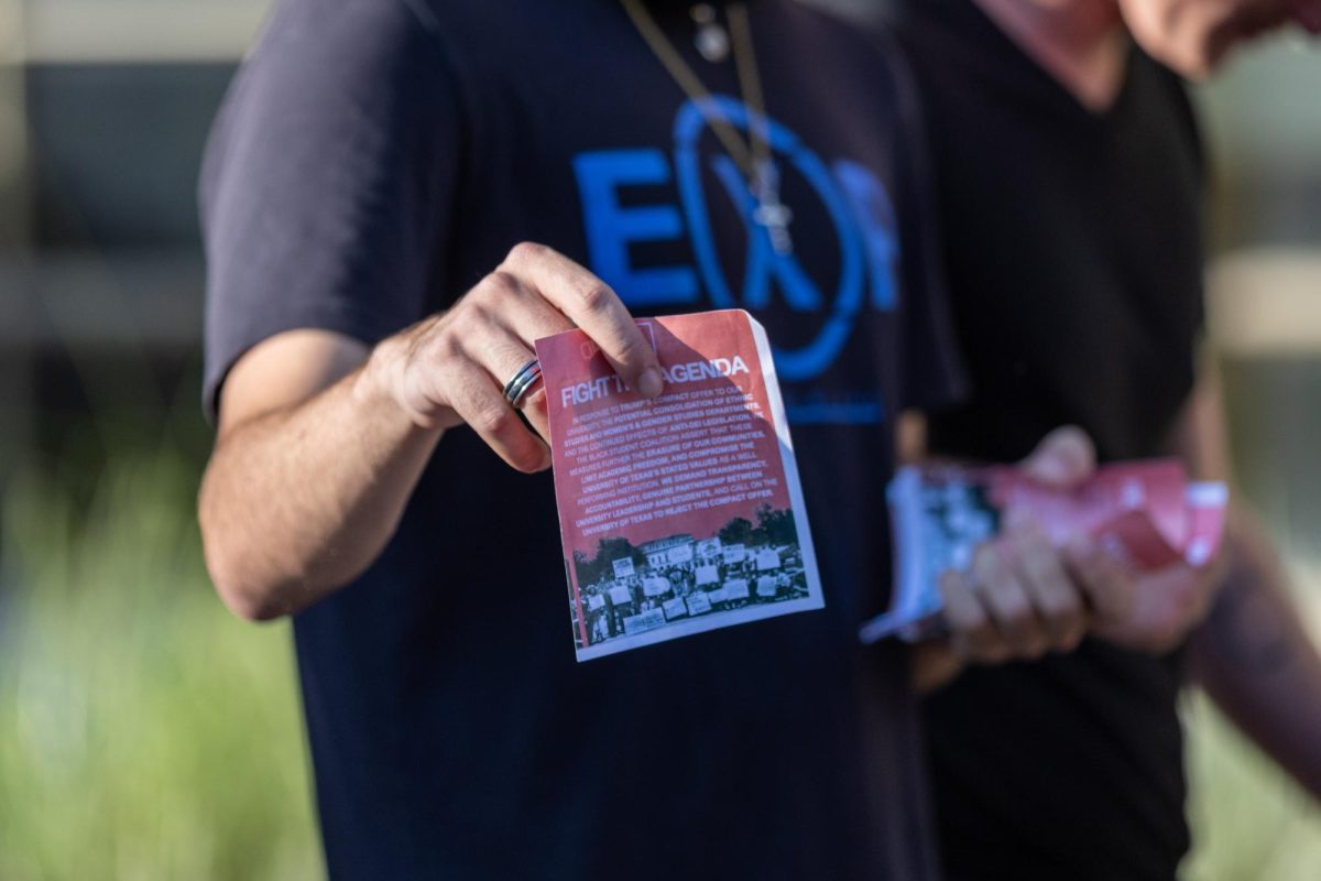 A “Fight the Agenda” flyer is shown to the camera on Wednesday, Oct. 22.