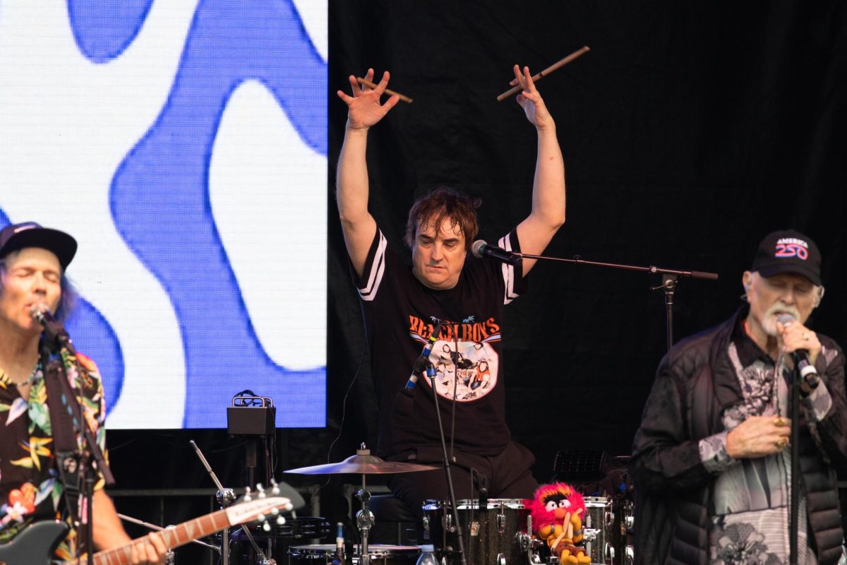 The Beach Boys drummer Jon Bolton raises his drumsticks during a performance on the LBJ Lawn on Nov. 1. The band performed at the Longhorn City Limits following the Texas vs. Vanderbilt game.