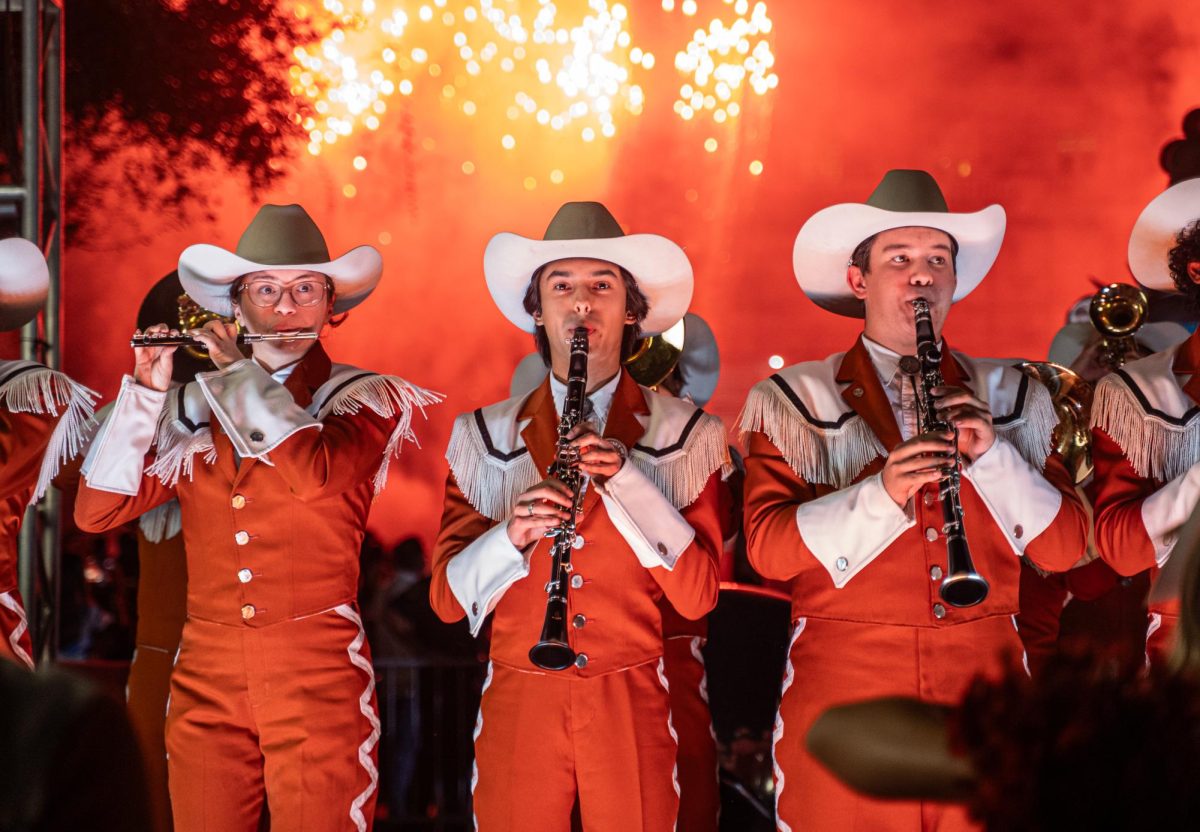 Longhorn Band perform alongside the Texas Spirit Squad at the Longhorn Lights celebration held at the South Mall of UT campus on Nov. 18, 2025.