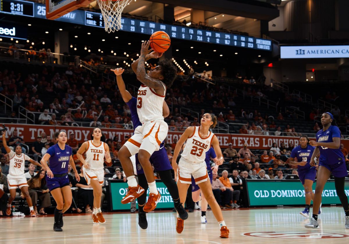 Senior guard Rori Harmon attempts a shot during Texas' game against James Madison at the Moody Center on Nov. 19.