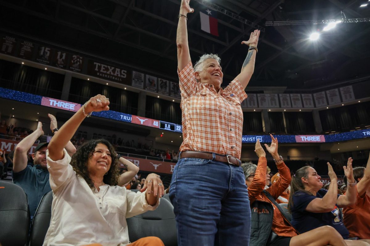 Longhorn fans celebrate the final point of the first half seconds before the shot clock runs out during Texas' game against James Madison at the Moody Center on Nov. 19.