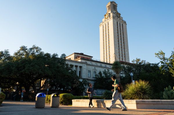 Students walk by the UT Tower pictured from the East Mall on Nov. 2.