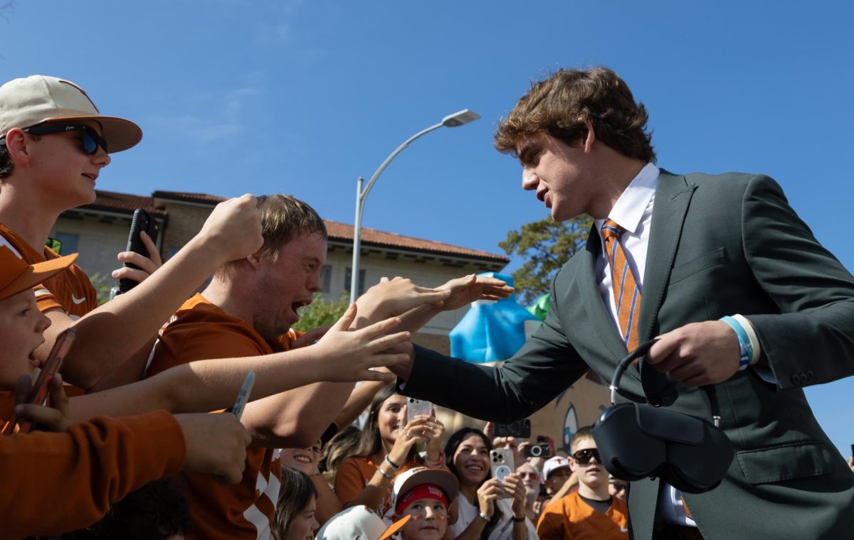 Arch Manning greets fans before heading into DKR for the game against the Arkansas Razorbacks on Nov. 22, 2025. 