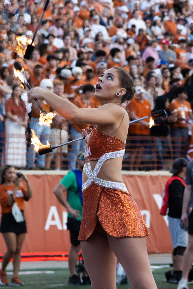 Feature twirler Gracie Williams throws batons during the game against the Arkansas Razorbacks on Nov. 22, 2025. 