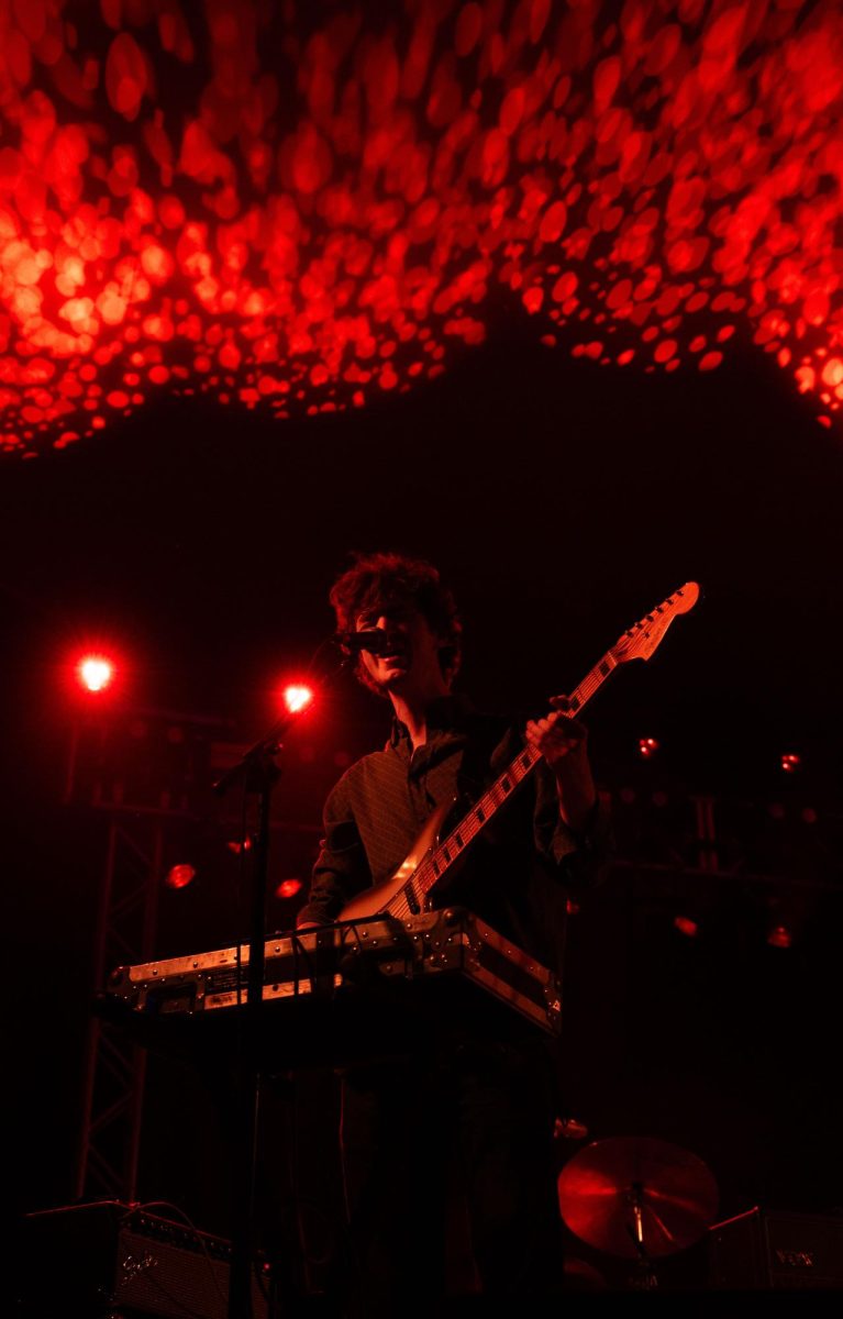 Fred Donlon-Mansbridge supports Dove Ellis during their opening set at Stubb's Waller Creek Amphitheater on Nov. 5.