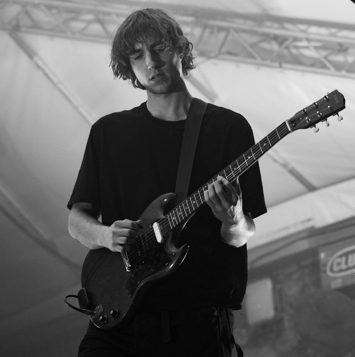Lead singer Cameron Winter plays guitar during Geese's set at Stubb's Waller Creek Amphitheater on Nov. 5.