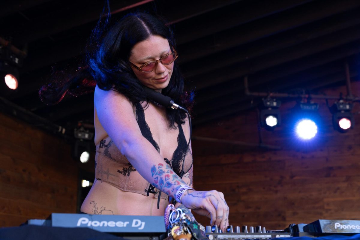 Orya, an Austin-based DJ, performs at Scoot Inn on Nov. 8. She was the second opener before DJ Mandy took the stage.