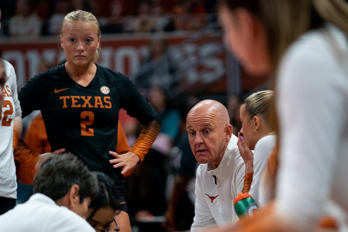 Head volleyball coach Jerritt Elliott talks with his team during a timeout of Texas' game against Stanford at the Moody Center on Sept. 7, 2025. 