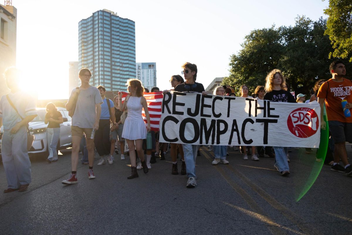 Protesters walk down 21st street during the Students for a Democratic Society protest on Oct. 20, 2025.