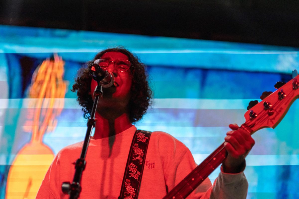 Nevin Varghese, guitarist for band Study Break sings during a performance at the Longhorn Artists Connect showcase on Jan. 22.