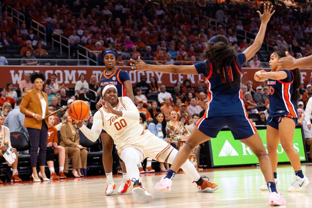 Senior Kyla Oldacre falls while passing the ball during a game against Auburn on Thursday, Jan. 8.
