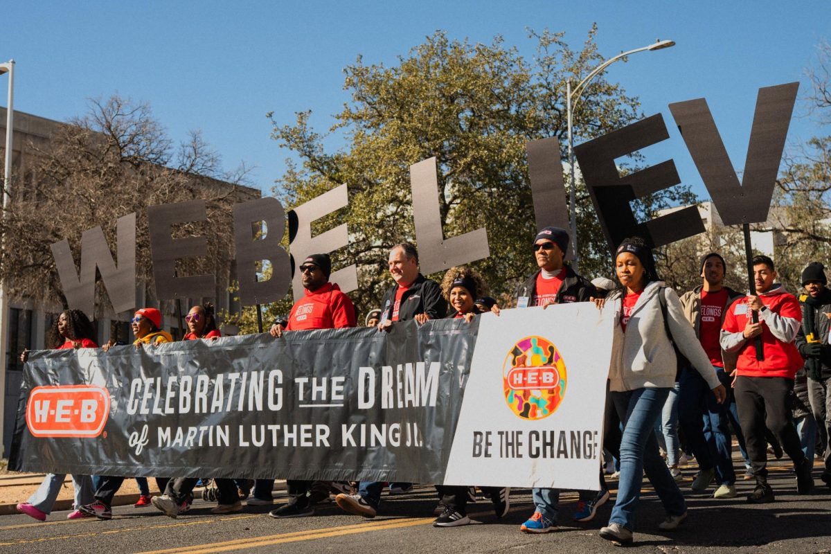 HEB workers march along 11th Street during the Dr. Martin Luther King Jr. parade on January 19, 2026.