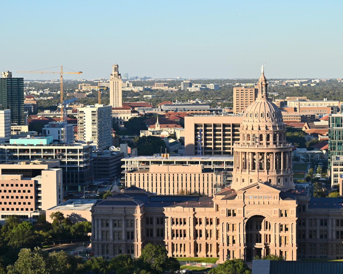 The Texas Capitol is pictured in the foreground with the UT Tower in the distance on Nov. 4, 2025.
