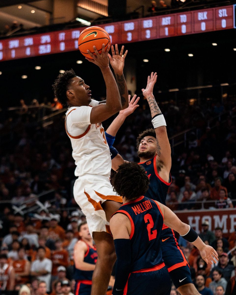 Junior Dailyn Swain attempts a layup during Texas' game against Virginia on Wednesday.