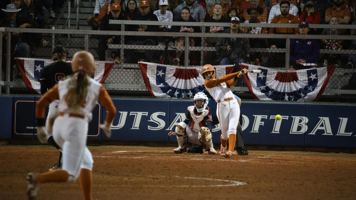 Freshman infielder Caigan Crabtree  hits a foul ball during Texas' game against Nebraska in San Antonio Feb. 6.