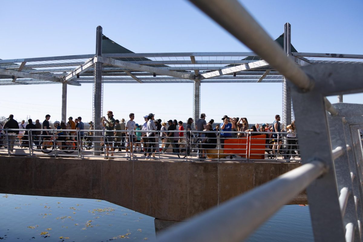 People walk around the intersection part of the Wishbone Bridge at its grand opening on Feb. 7.