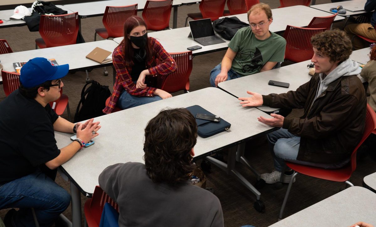 Members of the UT Music Appreciation Club discuss Hayley Williams’ 2025 album, "Ego Death at a Bachelorette Party," during a meeting at the George I. Sanchez Building on Jan. 28.