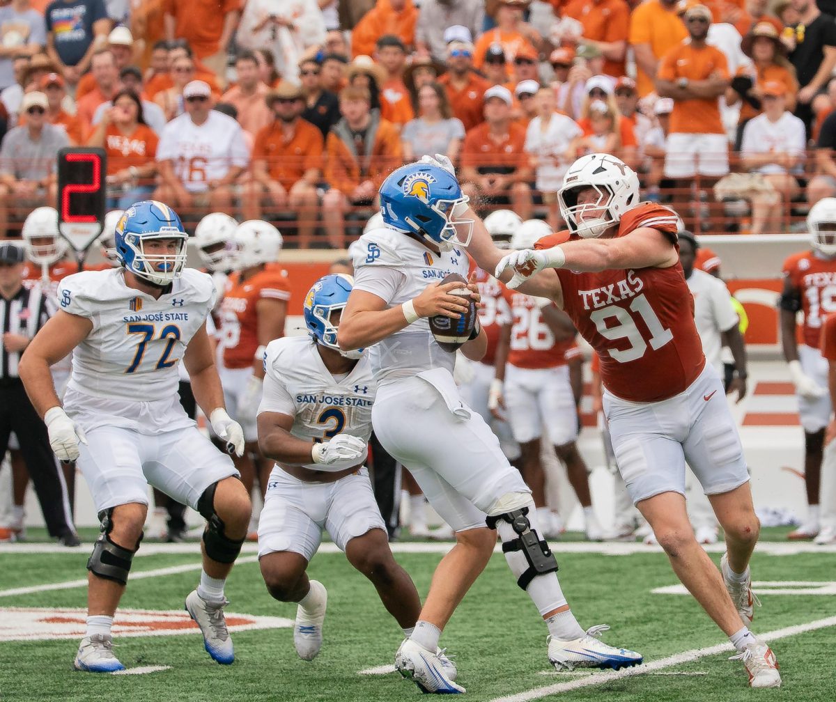 Junior Ethan Burke rounds the edge and grabs Spartan quarterback Walker Eget against San José State on Sept. 6, 2025. 