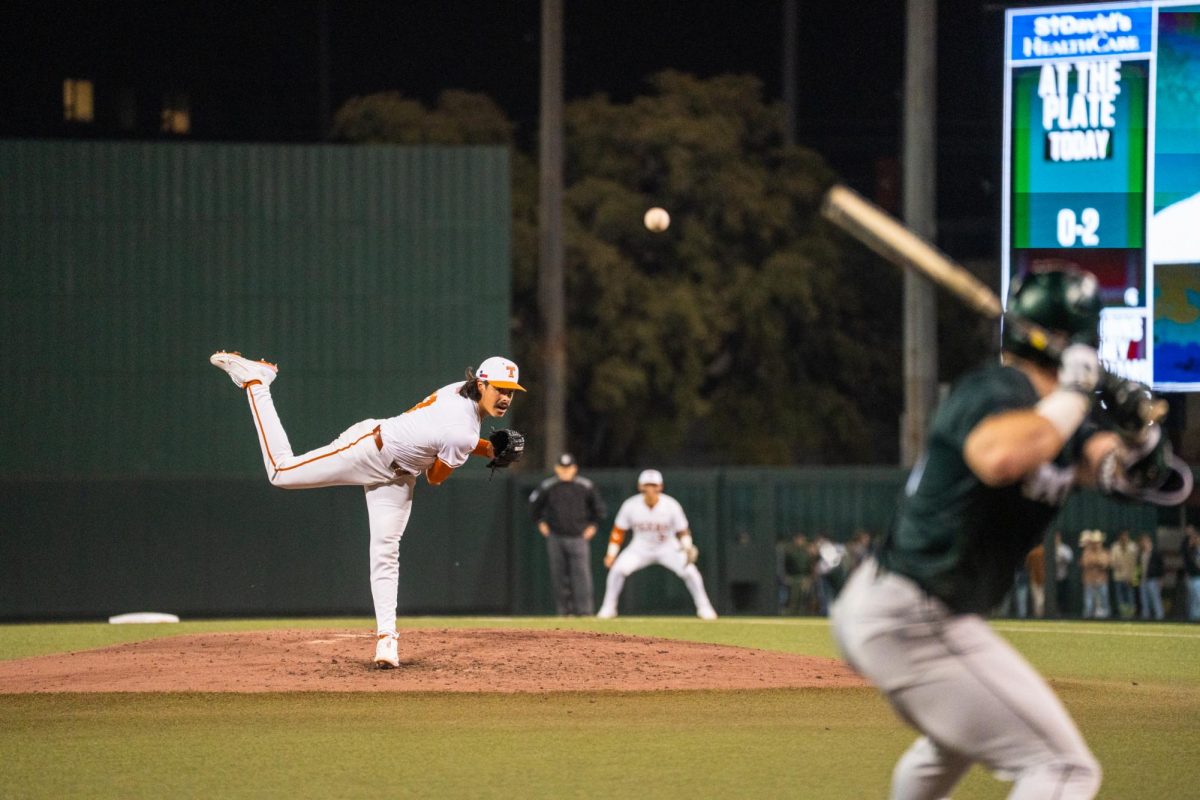 Senior right-handed pitcher Ruger Riojas pitches a ball during an 8-1 home win against Michigan State on Friday, Feb. 20.
