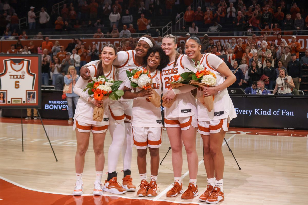 Texas seniors pose for a photo during Senior Night on Feb. 22. The team celebrated Senior Night after a 92-42 Longhorn win against Mississippi State.
