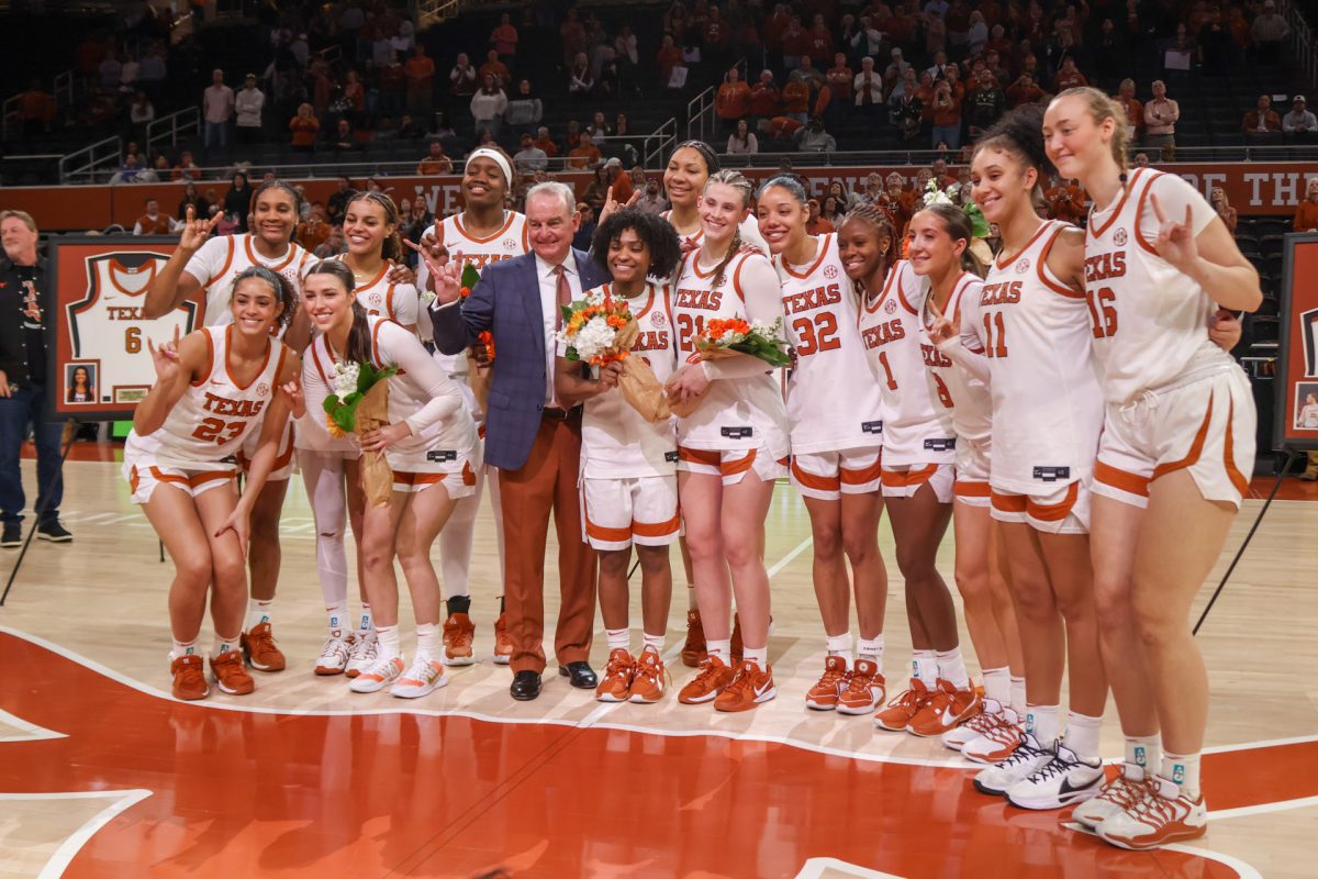 Texas women's basketball poses for a photo during Senior Night on Sunday, Feb. 22. The team celebrated Senior Night after a 92-42 Longhorn win against Mississippi State.