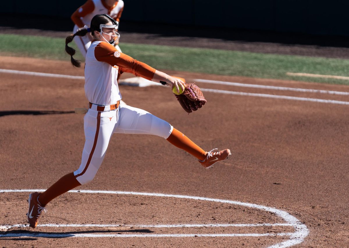 Junior right-handed pitcher Teagan Kavan pitches the ball at Texas' game against Northern Illinois University on Feb. 15.