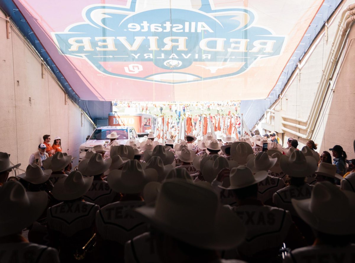 The Longhorn band walks into the Cotton Bowl before the game against the Oklahoma Sooners on Oct. 11, 2025.