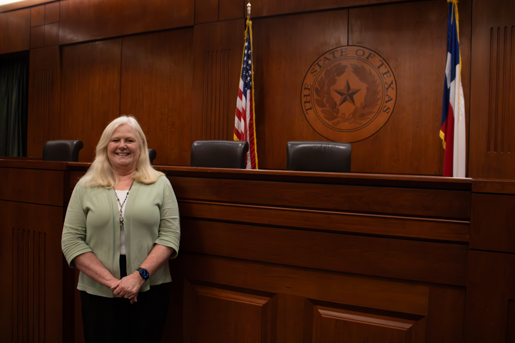 Pam Sigman, director of the Juvenile Justice Clinic, poses for a portrait at the Eidman Courtroom within the Texas Law School on Feb. 24.