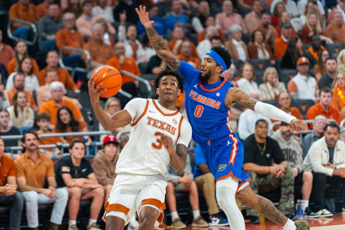 Junior guard Dailyn Swain fights through contact to get to the rim in a game against Florida at the Moody Center on Feb. 25, 2026.