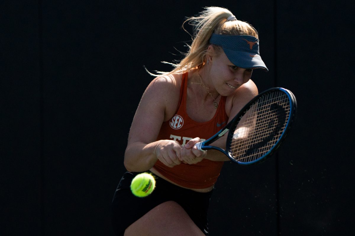 Texas sophomore Carmen Herea hits a backhand to Barbara Martinez from UTRGV during a singles match on Feb. 15.