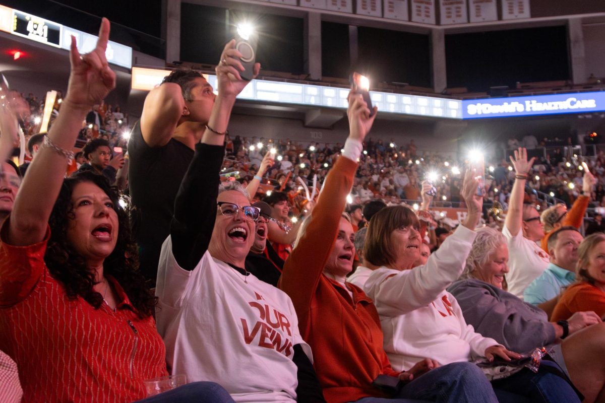 Fans participate in the Texas Fight chant during a timeout at the Texas vs. OU game on Feb. 1.