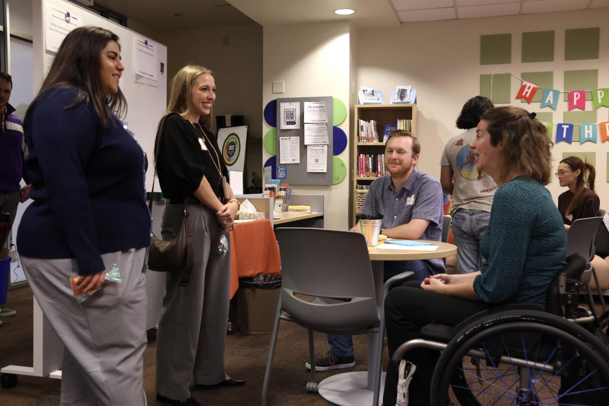 Visiting members speak with Emily Shryock in the Student Services Building on Feb. 3, 2026. Shryock contributed to the founding of the Disability and Cultural Center three years prior.
