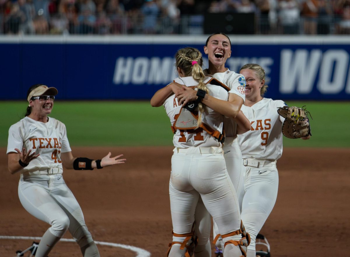 Sophomore Teagan Kavan smiles with her teammates after the last moments of a 10-4 victory over the Texas Tech Red Raiders that clinched a national championship on June 6, 2025. 