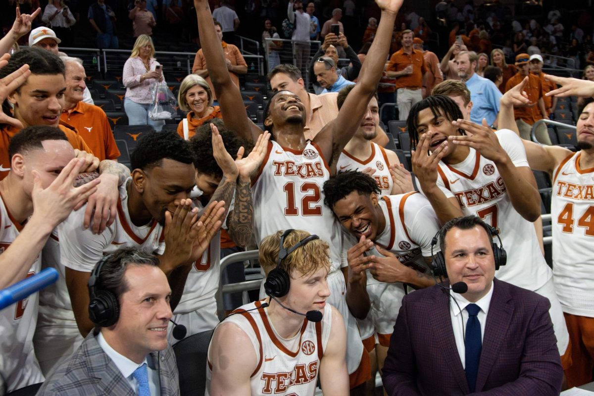 The Texas men's basketball team joins sophomore center Matas Vokietaitis' interview after winning a game against Ole Miss at Moody Center on Feb. 7. The Longhorns won with a final score of 79-68.