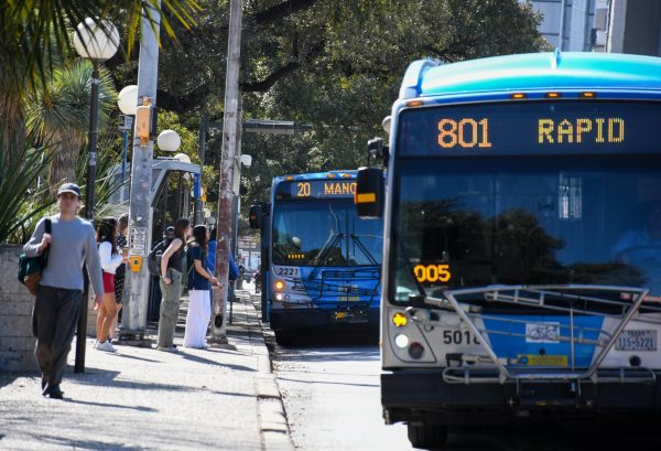 Students board CapMetro buses at the Guadalupe and West Mall Station on Feb. 9.