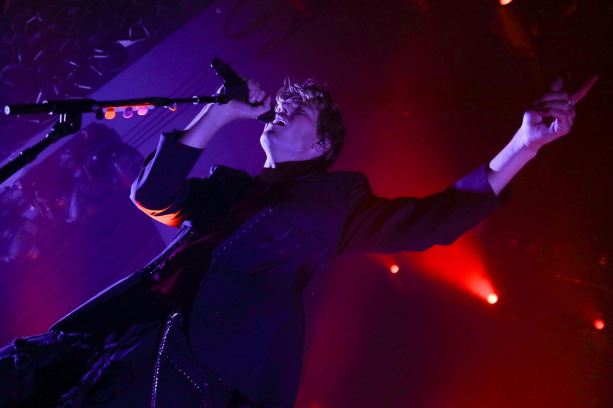 Ruel sings into a microphone during the Kicking My Feet tour at Emo’s Austin on Feb. 9, 2026.