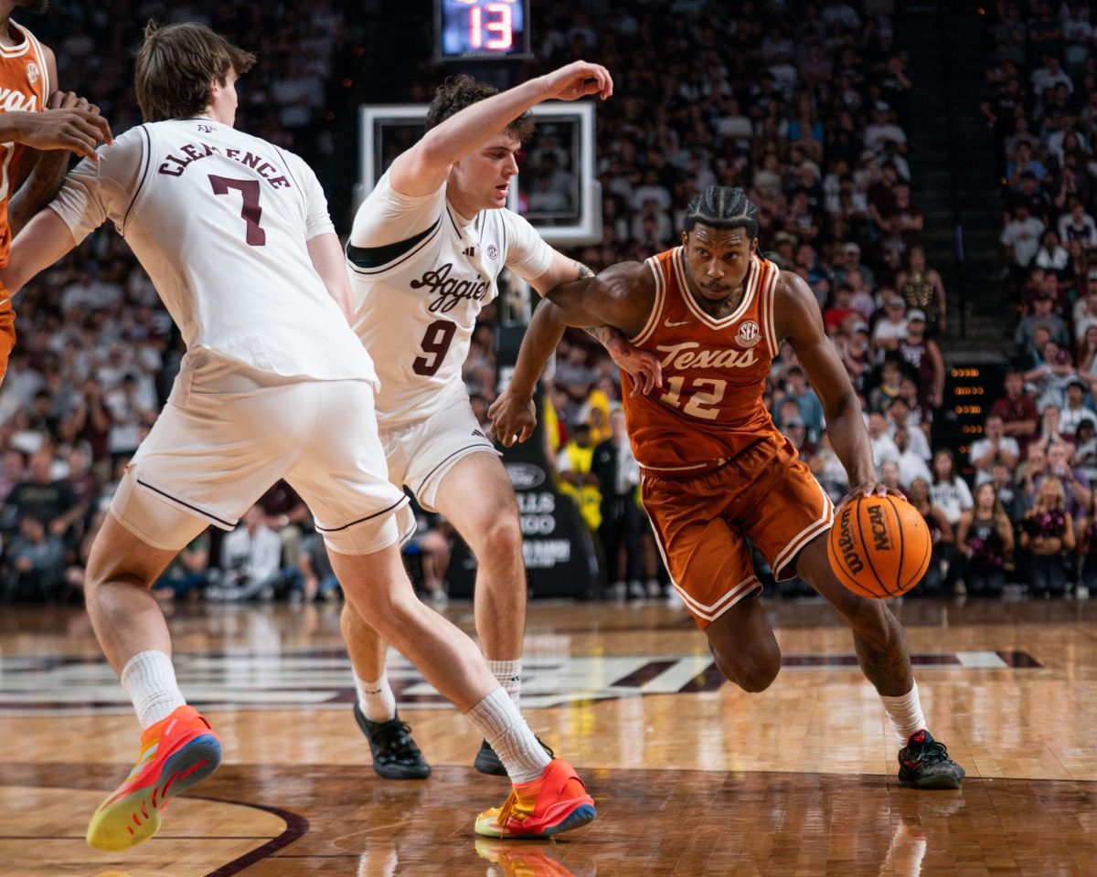 Texas A&M guard Ruben Dominguez (9) defends Texas guard Tramon Mark (12) during a game in College Station on Saturday, Feb. 28, 2026.