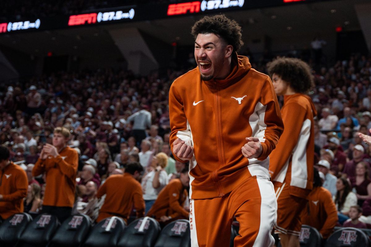 Texas guard Brandon Taylor celebrates on the bench after a play during the game against Texas A&M in College Station on Saturday, Feb. 28, 2026.