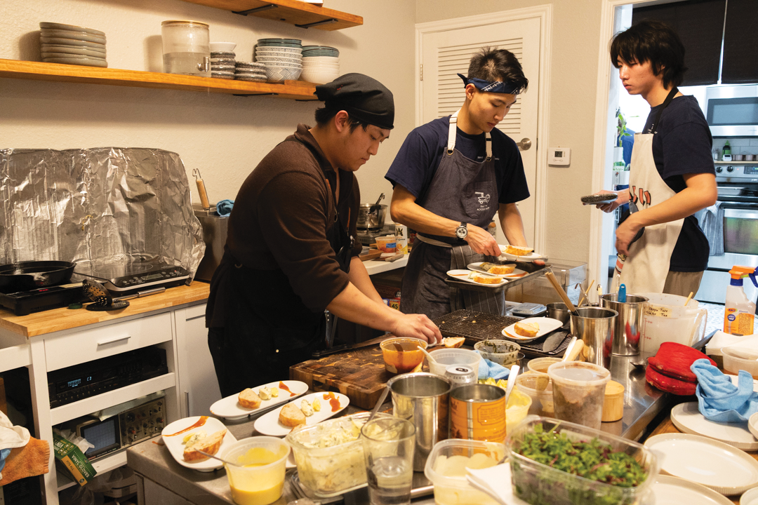 Student chef Josh Hee prepares food for the Hog and Mortar pop up restaurant on Feb. 18.
